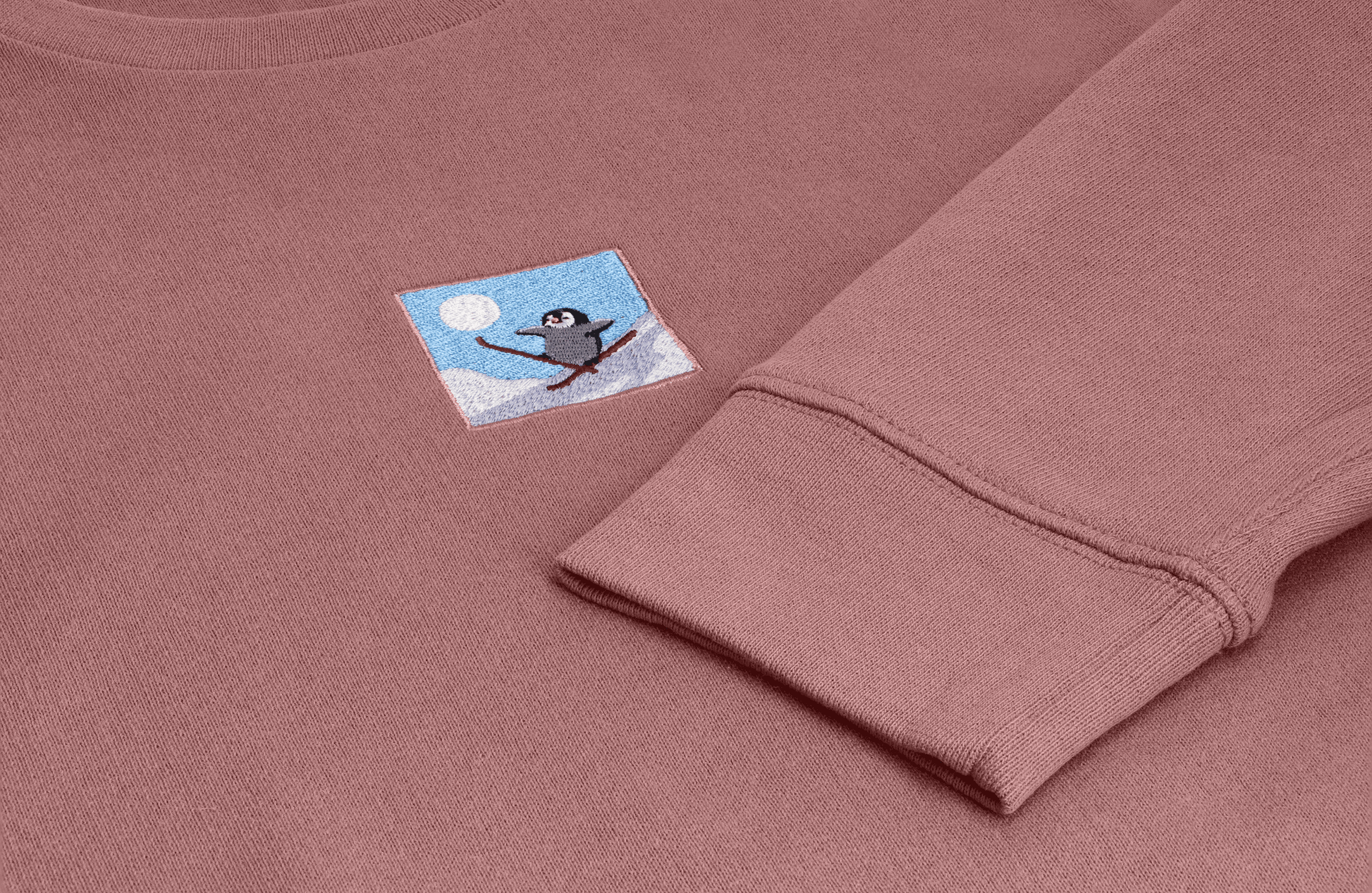 Hit the ski slopes with this unisex adult sweater with skiing penguin embroidery. Twin with your family: we have kids & adults sizes available.