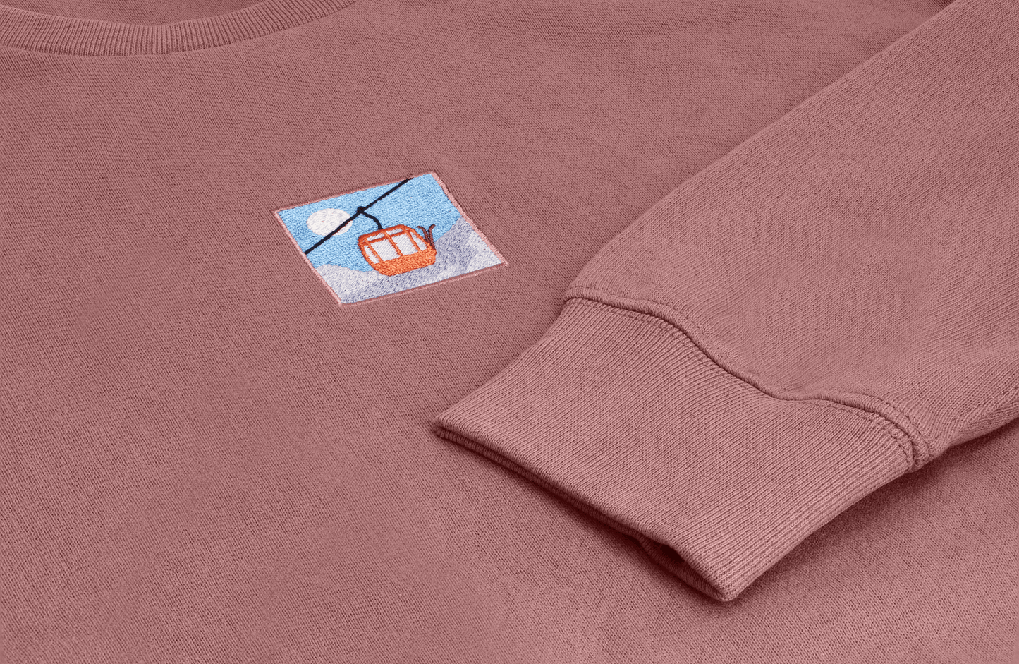 Hit the ski slopes with this unisex adult sweater with skilift embroidery. Twin with your family: we have kids & adults sizes available.